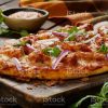 Butter Chicken Pizza on Naan Bread with Red Onion and Cilantro
